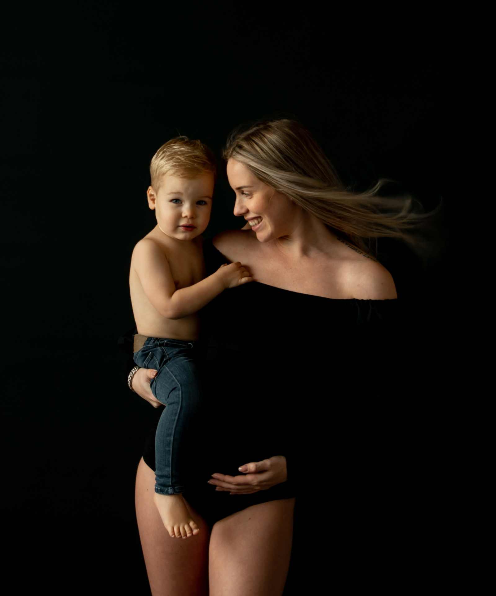 moeder en kind zwangerschapsshoot